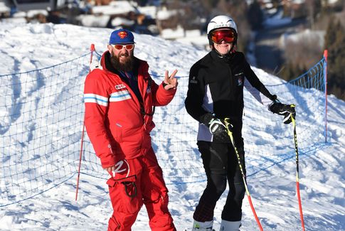 Cours compétition de ski, moniteur et élève
